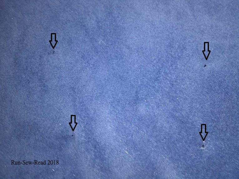 Closeup of stitches w arrows w